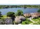 Stunning aerial view showcasing the lakefront community and well-maintained homes at 508 Quail Lake Dr, Debary, FL 32713
