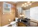 Elegant bathroom featuring marble countertop vanity, decorative accents and tiled shower-tub at 508 Quail Lake Dr, Debary, FL 32713