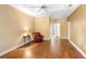 Spacious primary bedroom features hardwood floors, a tray ceiling, and a ceiling fan at 508 Quail Lake Dr, Debary, FL 32713