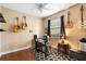 Bedroom featuring guitars, a keyboard, and hardwood floors at 508 Quail Lake Dr, Debary, FL 32713