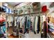 Organized walk-in closet featuring ample storage space with shelves, drawers, and rods for hanging clothes at 508 Quail Lake Dr, Debary, FL 32713