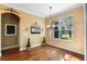 Dining area with a view of the lake and hardwood floors at 508 Quail Lake Dr, Debary, FL 32713