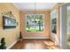 Light-filled dining area with hardwood floors and a lake view at 508 Quail Lake Dr, Debary, FL 32713