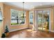 Charming dining area features hardwood floors and a lake view at 508 Quail Lake Dr, Debary, FL 32713