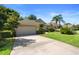 Inviting single-story residence with a spacious driveway, green lawn, and mature landscaping at 508 Quail Lake Dr, Debary, FL 32713