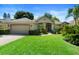 Charming single-story home with a well-kept lawn, mature trees, and a welcoming entrance at 508 Quail Lake Dr, Debary, FL 32713