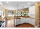 Spacious kitchen with granite counters, white cabinets, and hardwood flooring at 508 Quail Lake Dr, Debary, FL 32713