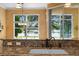 Kitchen sink area with granite countertops and a view of the lake at 508 Quail Lake Dr, Debary, FL 32713