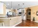 Open-concept kitchen with granite countertops and stainless steel appliances at 508 Quail Lake Dr, Debary, FL 32713