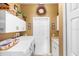 Well-organized laundry room with ample counter space, storage cabinets, and modern washer/dryer at 508 Quail Lake Dr, Debary, FL 32713