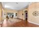 Spacious living room with hardwood flooring, ceiling fan, and large windows at 508 Quail Lake Dr, Debary, FL 32713