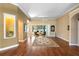Inviting living area with hardwood floors, custom lighting, and a view of the outdoor patio at 508 Quail Lake Dr, Debary, FL 32713