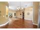 Open living room with hardwood floors, decorative lighting, and seamless access to the patio at 508 Quail Lake Dr, Debary, FL 32713