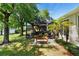 Enjoy the outdoors on the shaded patio with views of the lush landscaping and lake at 508 Quail Lake Dr, Debary, FL 32713