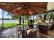 Cozy patio features comfortable seating and stunning lake views for relaxation and entertainment at 508 Quail Lake Dr, Debary, FL 32713
