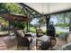 Enjoy outdoor living on this screened patio with fireplace and beautiful lake view at 508 Quail Lake Dr, Debary, FL 32713