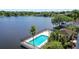 Community waterfront pool with a covered cabana and lounge chairs for residents at 508 Quail Lake Dr, Debary, FL 32713