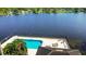 Waterfront community pool with lounge chairs for relaxing by the lake at 508 Quail Lake Dr, Debary, FL 32713
