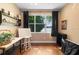 Bright, open room with large windows, hardwood floors and neutral color palette at 508 Quail Lake Dr, Debary, FL 32713