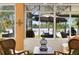 Relaxing sunroom with scenic views, comfortable seating, and natural light streaming through large windows at 508 Quail Lake Dr, Debary, FL 32713