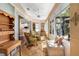 Sunroom with tiled floor, lots of windows with view of backyard, ceiling fan, and comfortable seating at 508 Quail Lake Dr, Debary, FL 32713