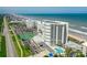 Aerial view showcasing the oceanfront community with the beach on one side at 5207 S Atlantic Ave # 723, New Smyrna Beach, FL 32169