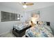 Inviting bedroom with twin beds, beach artwork, and ample natural light for a cozy feel at 5207 S Atlantic Ave # 723, New Smyrna Beach, FL 32169