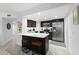 Modern kitchen featuring dark cabinets, stainless appliances, marble counters, and a cozy breakfast bar at 5207 S Atlantic Ave # 723, New Smyrna Beach, FL 32169