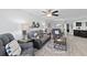 Comfortable living room with modern decor and view of kitchen bar at 5207 S Atlantic Ave # 723, New Smyrna Beach, FL 32169