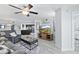 Cozy living room featuring modern furnishings and open layout with kitchen and dining area at 5207 S Atlantic Ave # 723, New Smyrna Beach, FL 32169