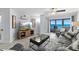 Inviting living room with ocean view through sliding glass doors to balcony at 5207 S Atlantic Ave # 723, New Smyrna Beach, FL 32169