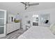 Bright bedroom showing vanity and access to a bathroom, creating a peaceful and functional retreat at 5207 S Atlantic Ave # 723, New Smyrna Beach, FL 32169