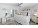 Bright bedroom with ocean-themed decor, including a vanity, offers a peaceful and stylish retreat at 5207 S Atlantic Ave # 723, New Smyrna Beach, FL 32169