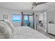 Bright bedroom with a sliding door to a private balcony, and a comfortable seating area at 5207 S Atlantic Ave # 723, New Smyrna Beach, FL 32169