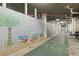 Large recreation room with shuffleboard and ocean themed mural along the wall at 5207 S Atlantic Ave # 723, New Smyrna Beach, FL 32169