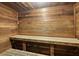 Private sauna with wood paneled walls, ceiling, and benches at 5207 S Atlantic Ave # 723, New Smyrna Beach, FL 32169