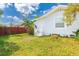 Exterior of the house with a small yard and fence providing privacy with a view of the surrounding area at 5261 3Rd St, Orlando, FL 32810