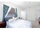 Cozy bedroom with soft carpet, a ceiling fan, and a bed with stylish bedding at 5261 3Rd St, Orlando, FL 32810