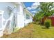 Exterior of the home with outdoor essentials and a view of the side yard at 5261 3Rd St, Orlando, FL 32810