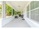 Inviting front porch perfect for relaxing with outdoor seating and a grilling area at 5261 3Rd St, Orlando, FL 32810