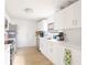 Clean and modern kitchen with stainless steel appliances, quartz countertops, and ample cabinet space at 5261 3Rd St, Orlando, FL 32810