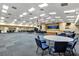 Large community room with stage, tables, and chairs, perfect for gatherings and events at 5305 Indian Ocean Loop, Tavares, FL 32778