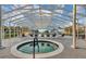 Community pool area featuring an in-ground hot tub and several lounge chairs at 5305 Indian Ocean Loop, Tavares, FL 32778