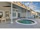 Outdoor community pool area features a hot tub, covered seating, and lounge chairs at 5305 Indian Ocean Loop, Tavares, FL 32778