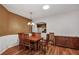 Traditional dining room featuring hardwood floors, a decorative light fixture, and wood furniture at 5305 Indian Ocean Loop, Tavares, FL 32778