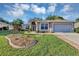 Inviting single-Gathering home with a landscaped front yard and two-car garage at 5305 Indian Ocean Loop, Tavares, FL 32778