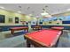 Community game room featuring multiple pool tables and overhead lighting for enjoyable recreation at 5305 Indian Ocean Loop, Tavares, FL 32778