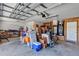 Spacious two car garage filled with storage of packed boxes and miscellaneous items at 5305 Indian Ocean Loop, Tavares, FL 32778