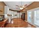Bright eat-in kitchen with white cabinets, stainless steel appliances, and wood-look floors at 5305 Indian Ocean Loop, Tavares, FL 32778