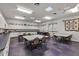 Bright community kitchen with ample counter space, cabinets, and tables, perfect for gatherings at 5305 Indian Ocean Loop, Tavares, FL 32778